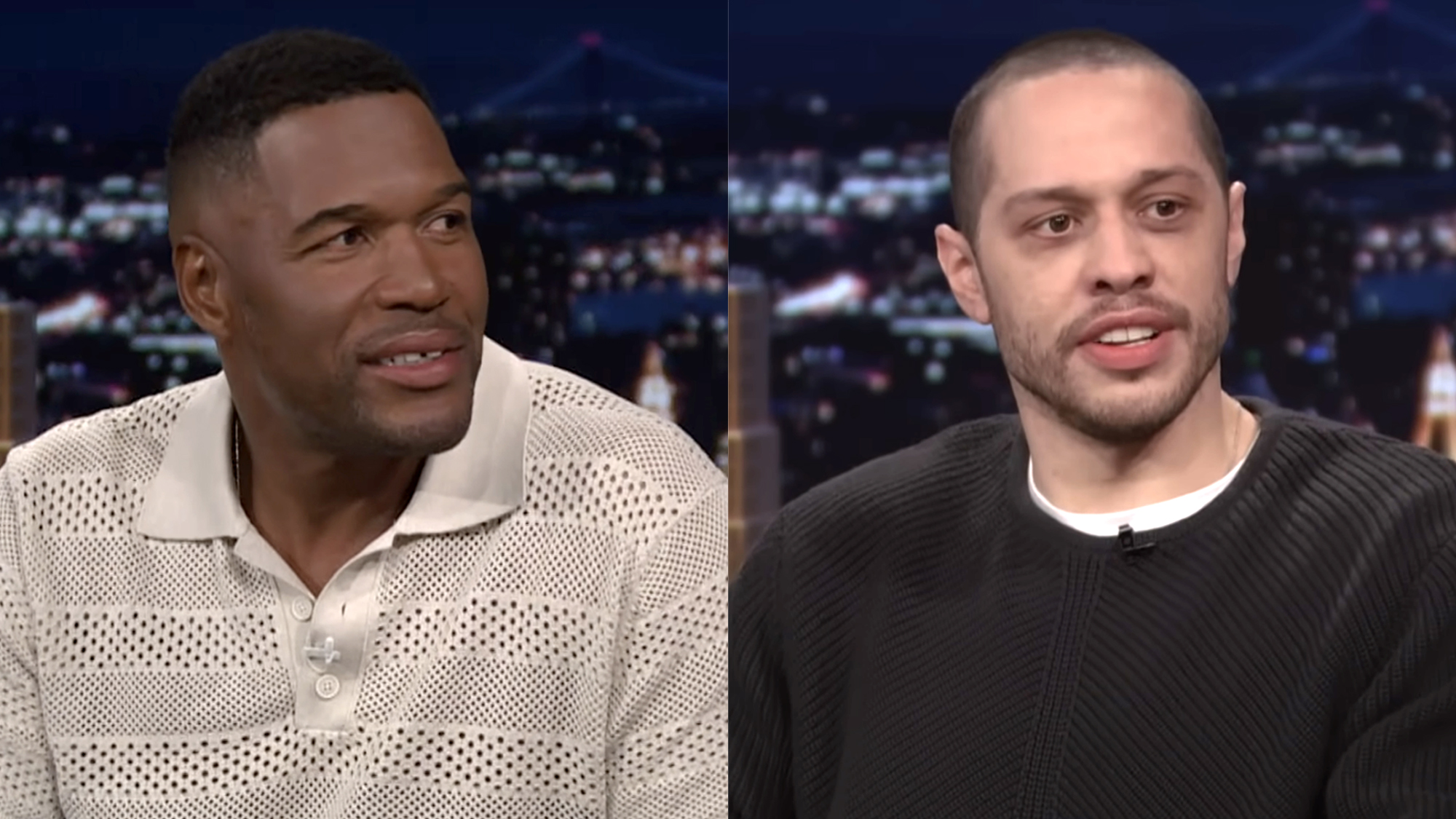 Michael Strahan in a striped light gray collared shirt, Pete Davidson wearing a black long sleeve with white t underneath, both appearing on The Tonight Show with Jimmy Fallon.