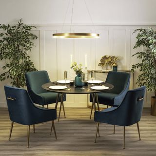 round LED pendant light over small dining room