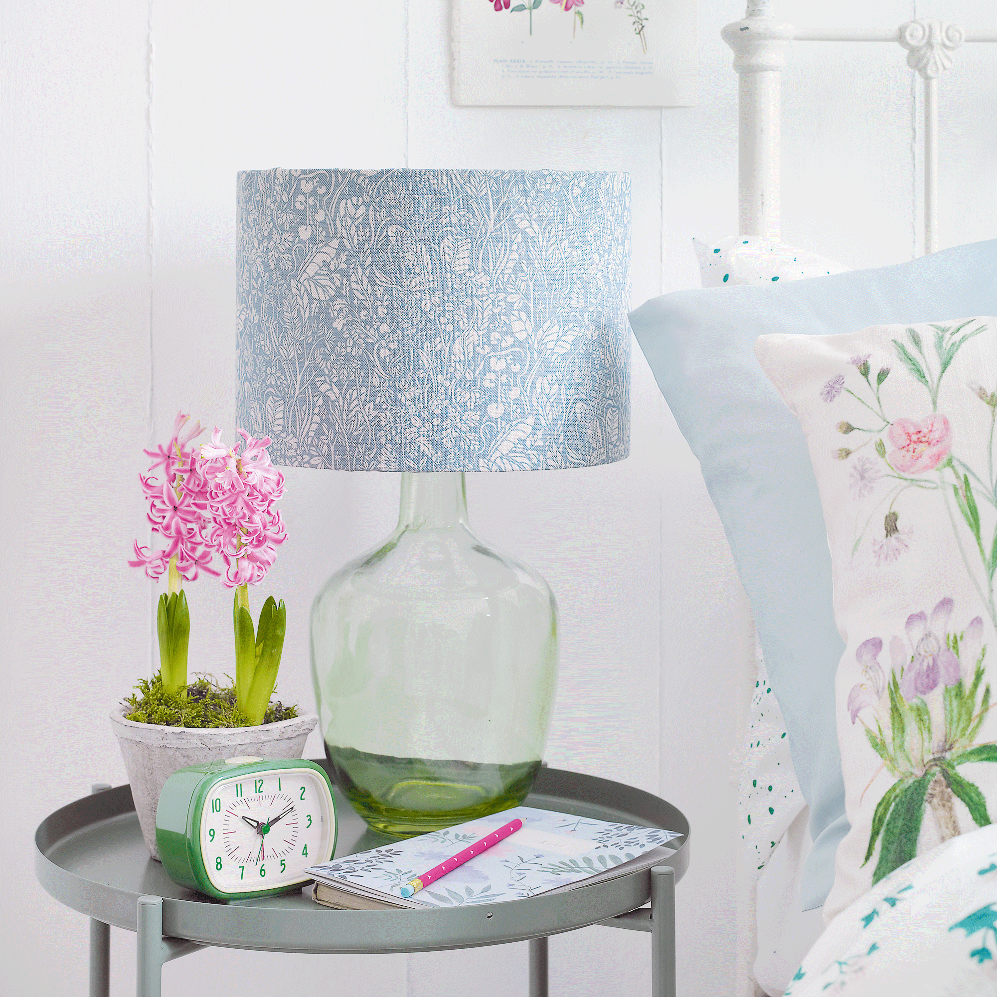Hyacinth on side table with lamp