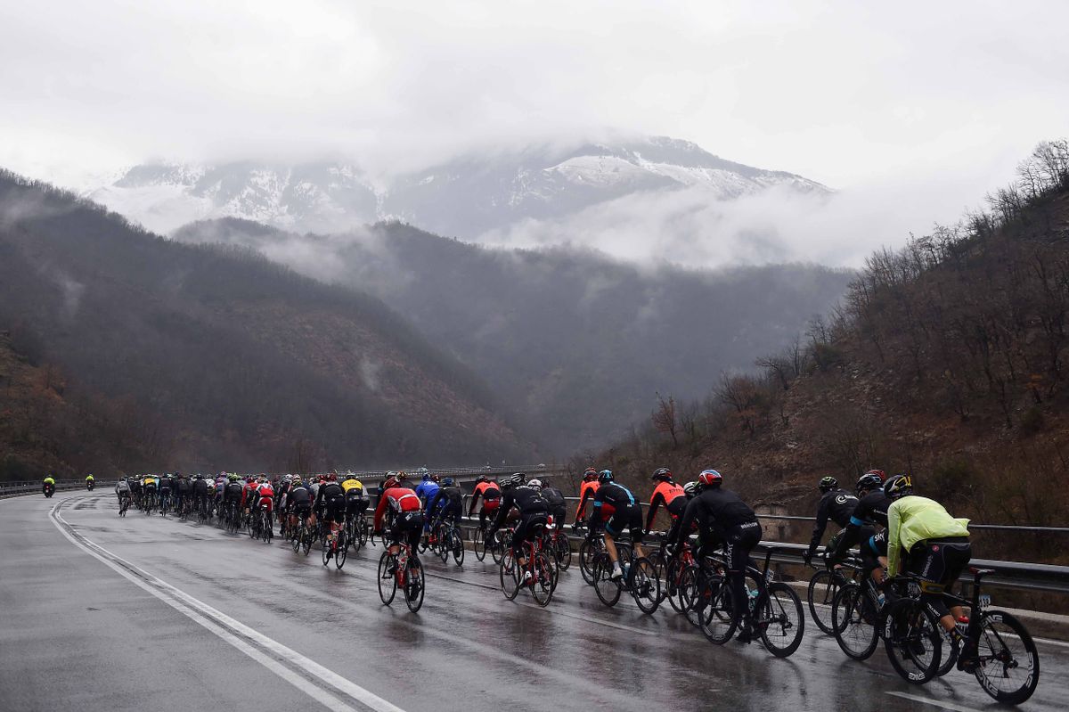 The peloton rides on under consistent rain