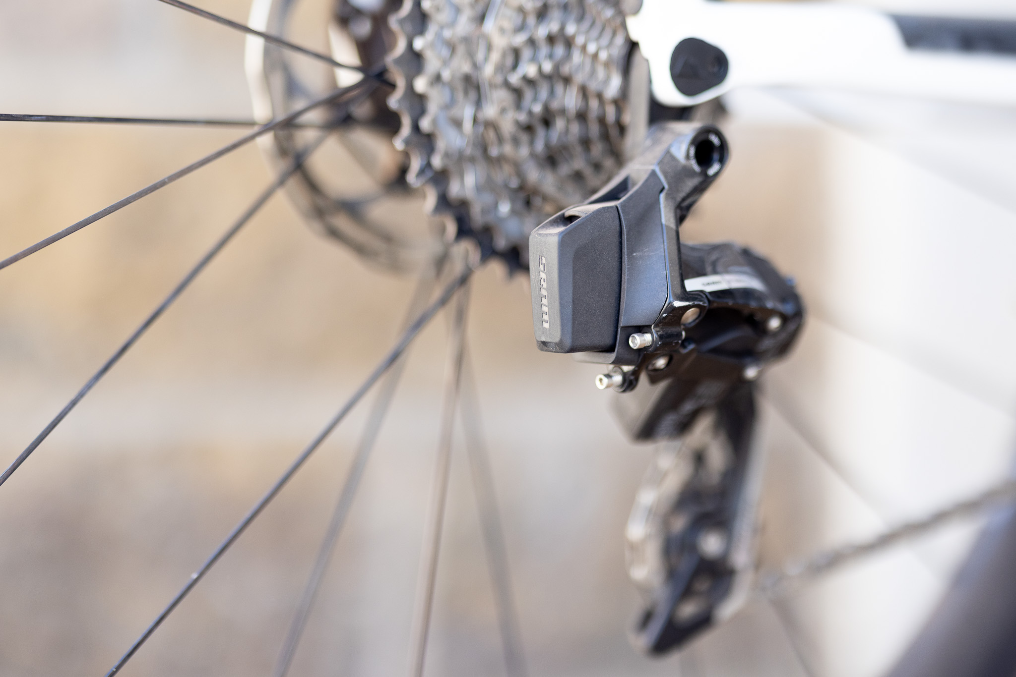 A SRAM AXS battery in a SRA Force rear derailleur