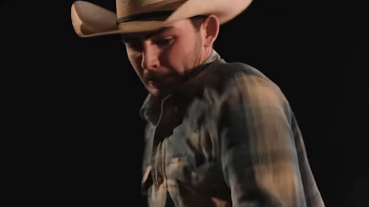 Carter on top of someone swinging a punch down in Dutton Ranch Season 1