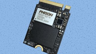 Phison E27T SSD controller against a colored background