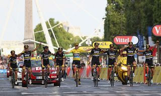 Chris Froome celebrates with his Team Sky teammates on the final Tour de France stage