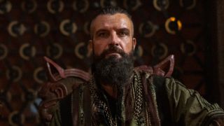 King Canute behind table on Vikings: Valhalla