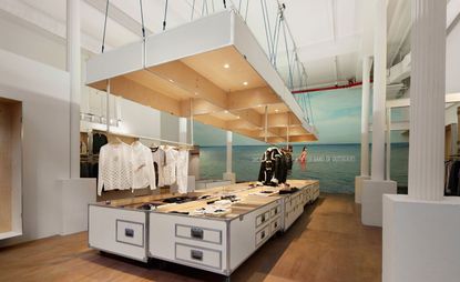 Clothing store with smartly suspended steamer trunks 