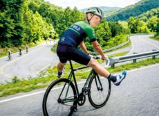image of Dr Hutch taking his feet of the pedals to ride downhill in a playful childish fashion