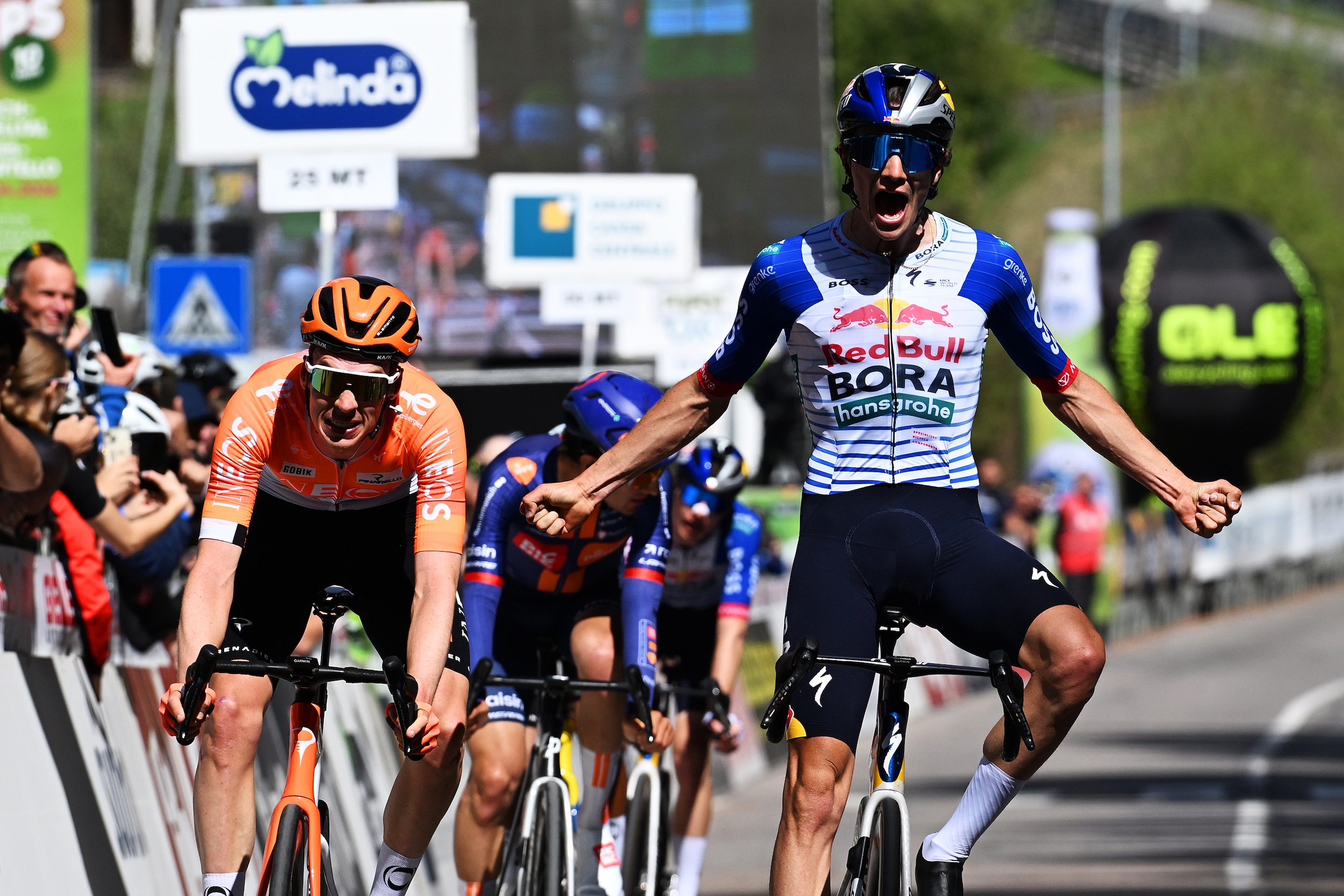 Giulio Pellizzari of Italy and Team Red Bull - BORA - hansgrohe celebrates at finish line as stage winner (R) ahead of Thymen Arensman of Netherlands and Team INEOS Grenadiers (L) during the 48th Tour of the Alps 2026, Stage 2 