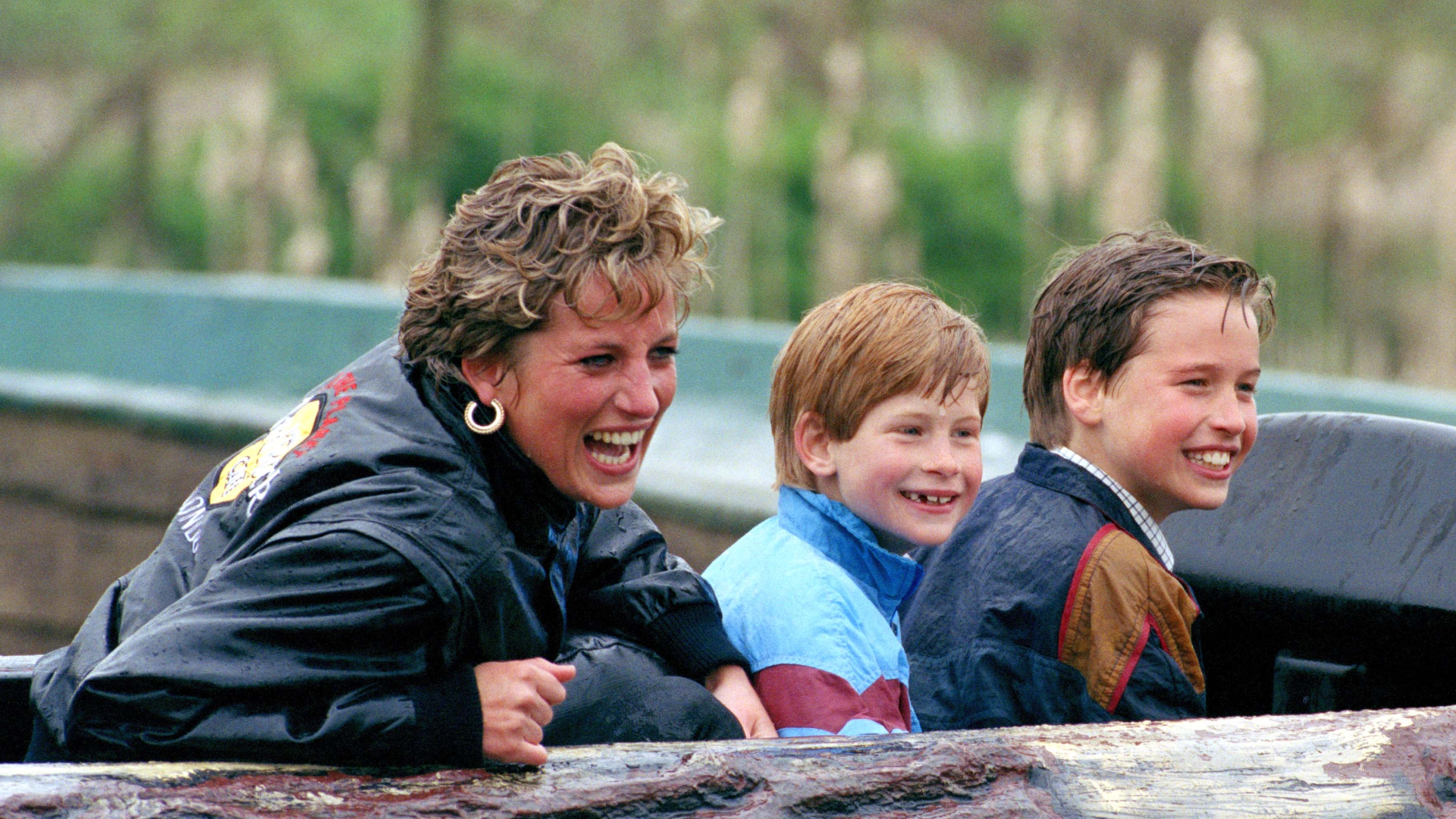 Princess Diana, Prince Harry and Prince William laughing in a log flume