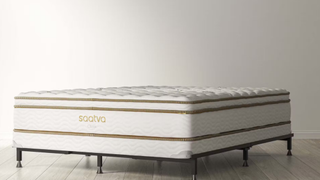 Saatva Mattress Foundation shot from an angle, with a Saatva Classic Mattress on top and a Saatva Universal Bed Frame on the bottom