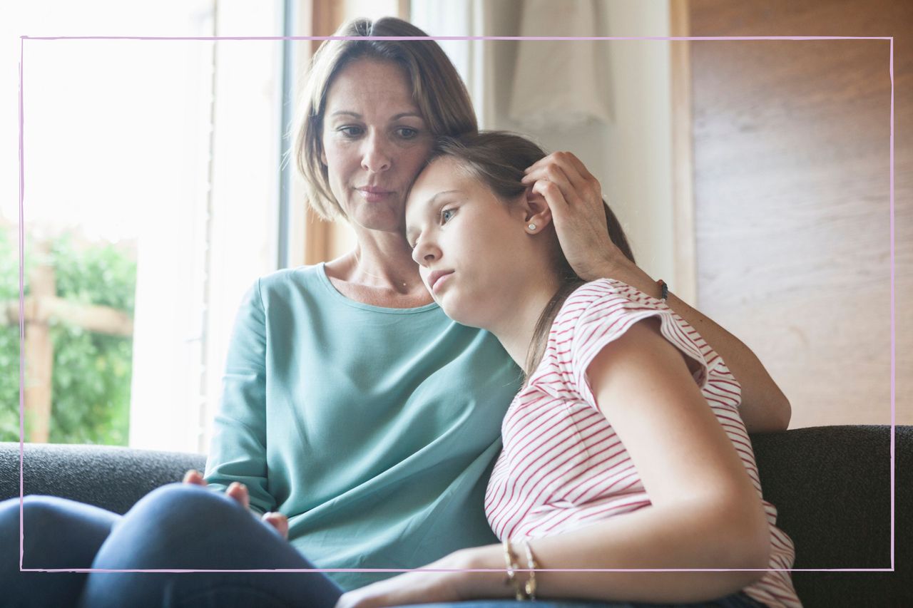 Parent talking to worried child