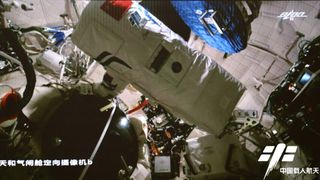 Chinese astronauts during their second spacewalk at the Tianhe space station