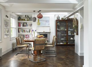 Dining room with bookcase and leather chairs