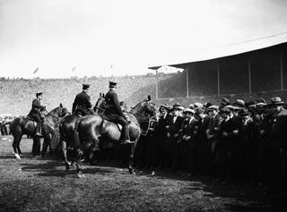 Mounted police at the 1923 FA Cup final between Bolton Wanderers and West Ham United at Wembley Stadium.