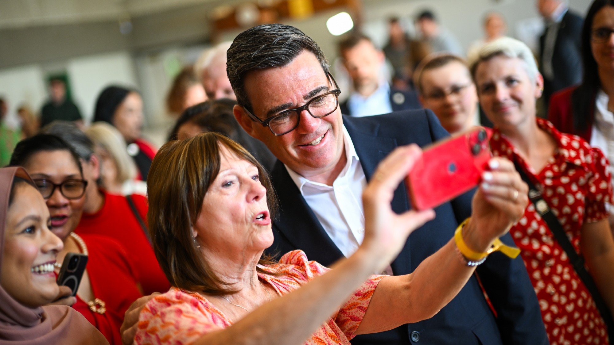 Andy Burnham poses for a selfie with a member of the public during a visit to Stevenage