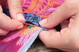 Stitch the binding by hand