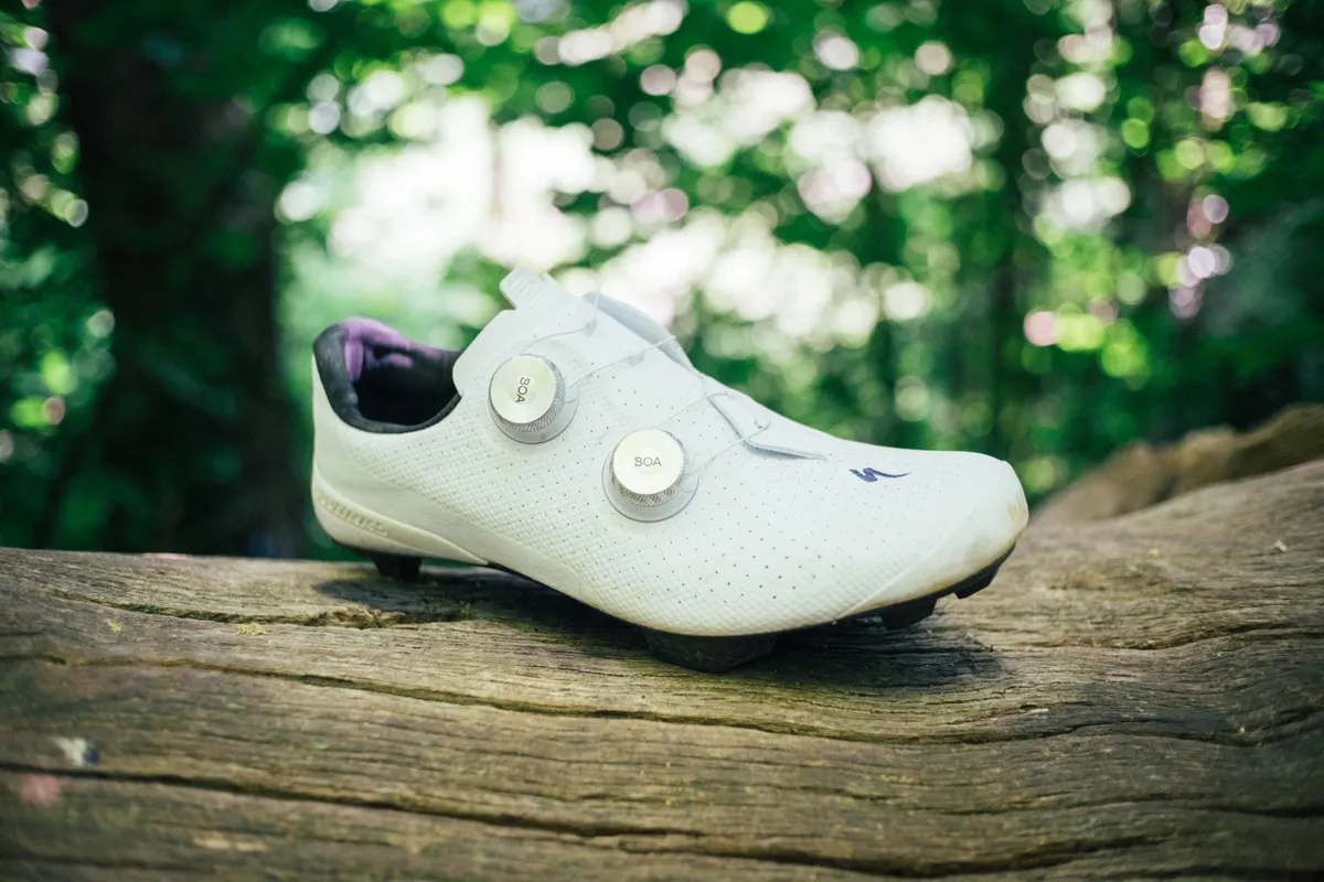 A white Specialized S-Works Recon gravel shoe 