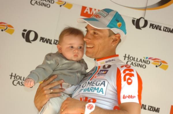 Gilbert on the podium with his young son