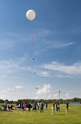 A NASA balloon carries student-designed experiments during the first Balloonsat High-Altitude Flight competition in 2010. 