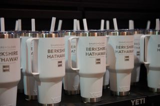 Berkshire Hathaway branded Yeti mugs on the exhibition floor inside the CHI Health Center during the Berkshire Hathaway annual shareholders meeting