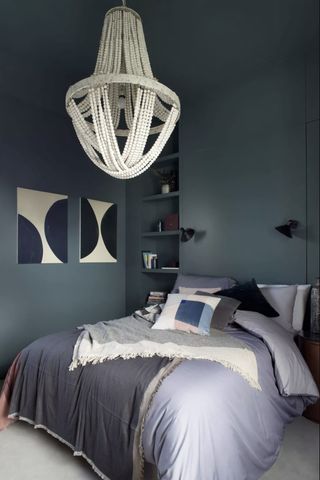 Dark blue bedroom with painted ceiling