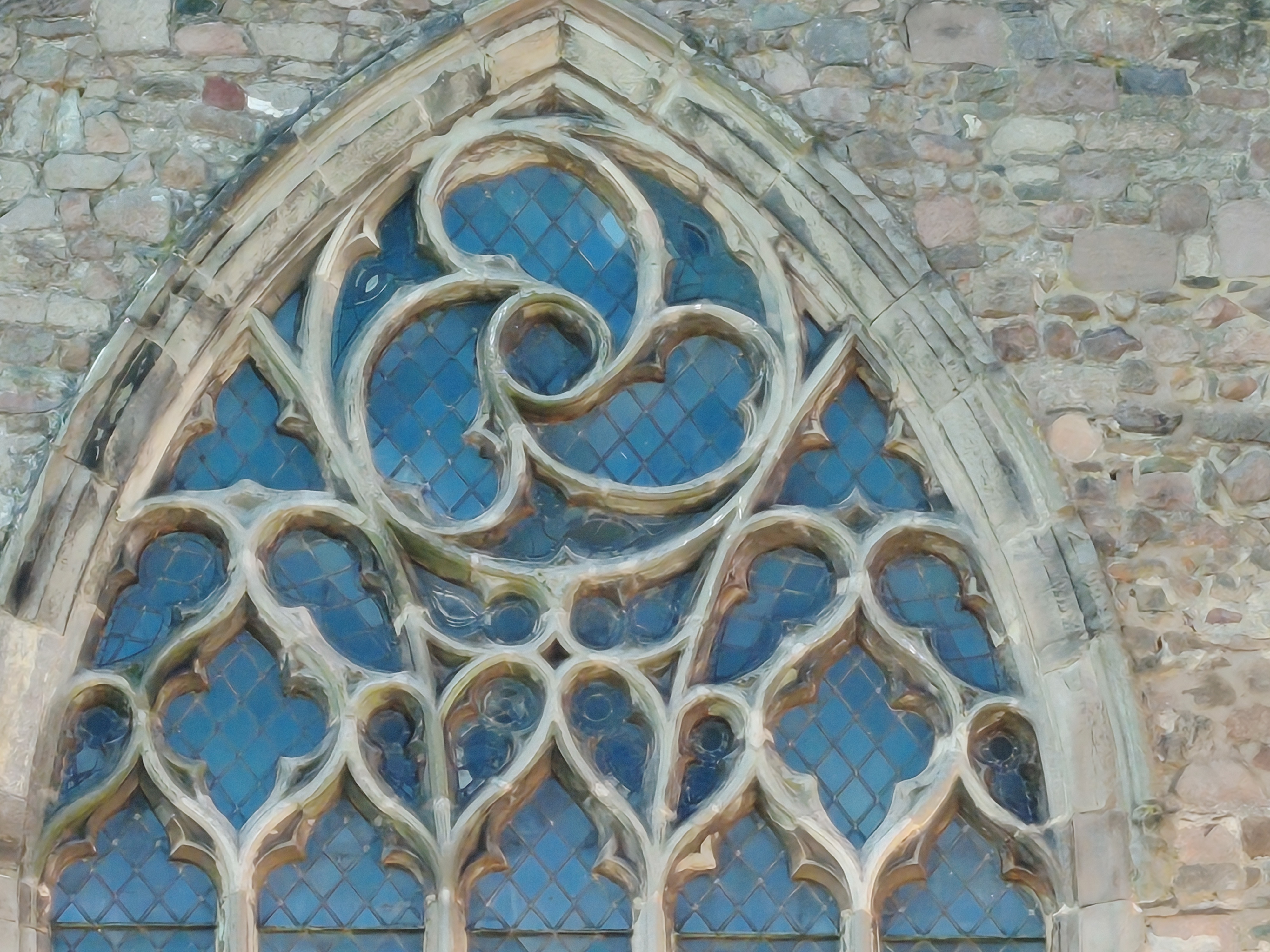 Stone church with large windows
