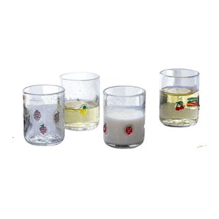 Four juice glasses with motifs