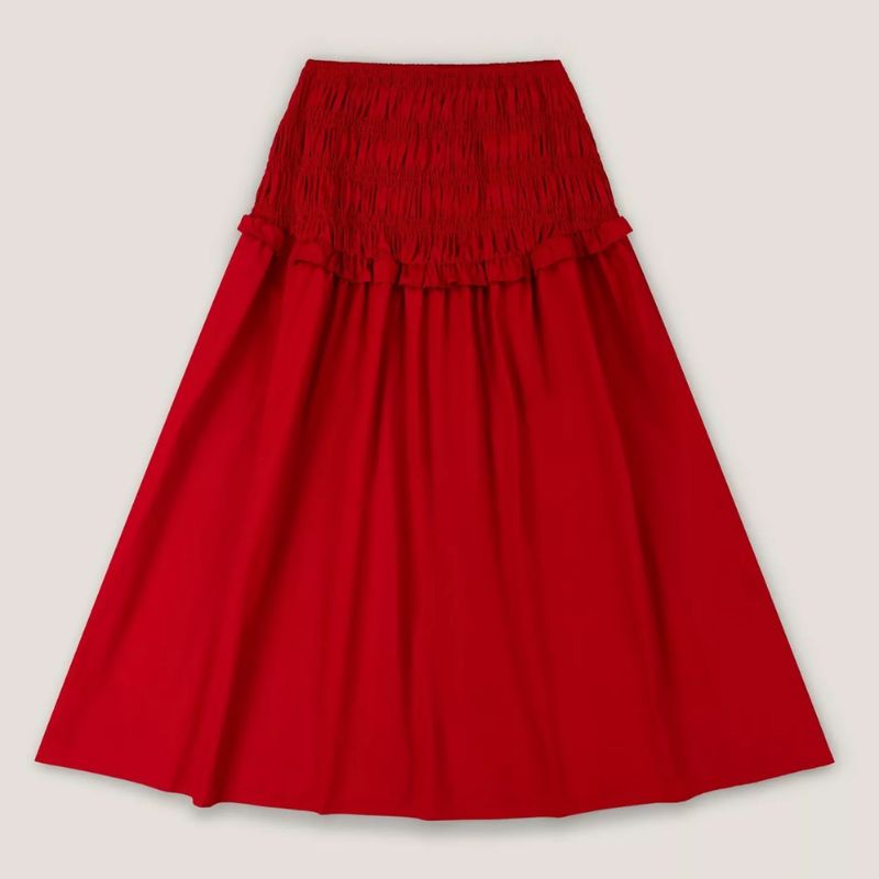 A cutout of a red drop waist skirt by Omnes
