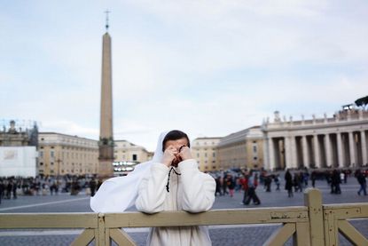A nun prays in St. Peter's Square 