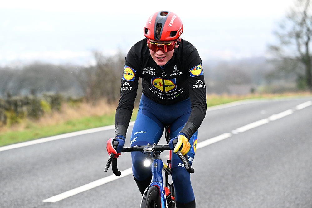 Harry Hudson riding in the Peak District, wearing blue and yellow winter Lidl-Trek kit