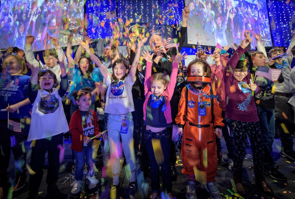New Horizons principal investigator Alan Stern (center) celebrates with school children at the moment the spacecraft was planned to reach its closest approach to Kuiper Belt object Ultima Thule on Jan. 1, 2019 at the Johns Hopkins University Applied Physics Laboratory. It is the furthest flyby in history.