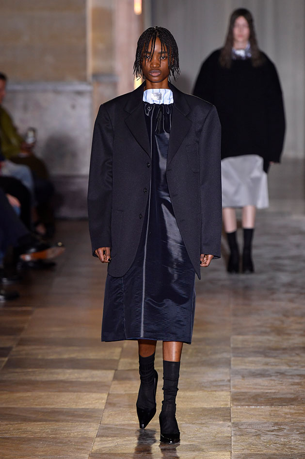 Raf Simons suggests men get back to the boardroom in a slouchy jacket and dress