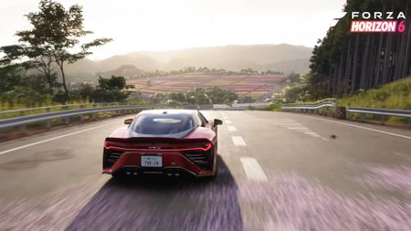 Forza Horizon 6 Toyota GR GT cover car driving towards coloured fields in the distance