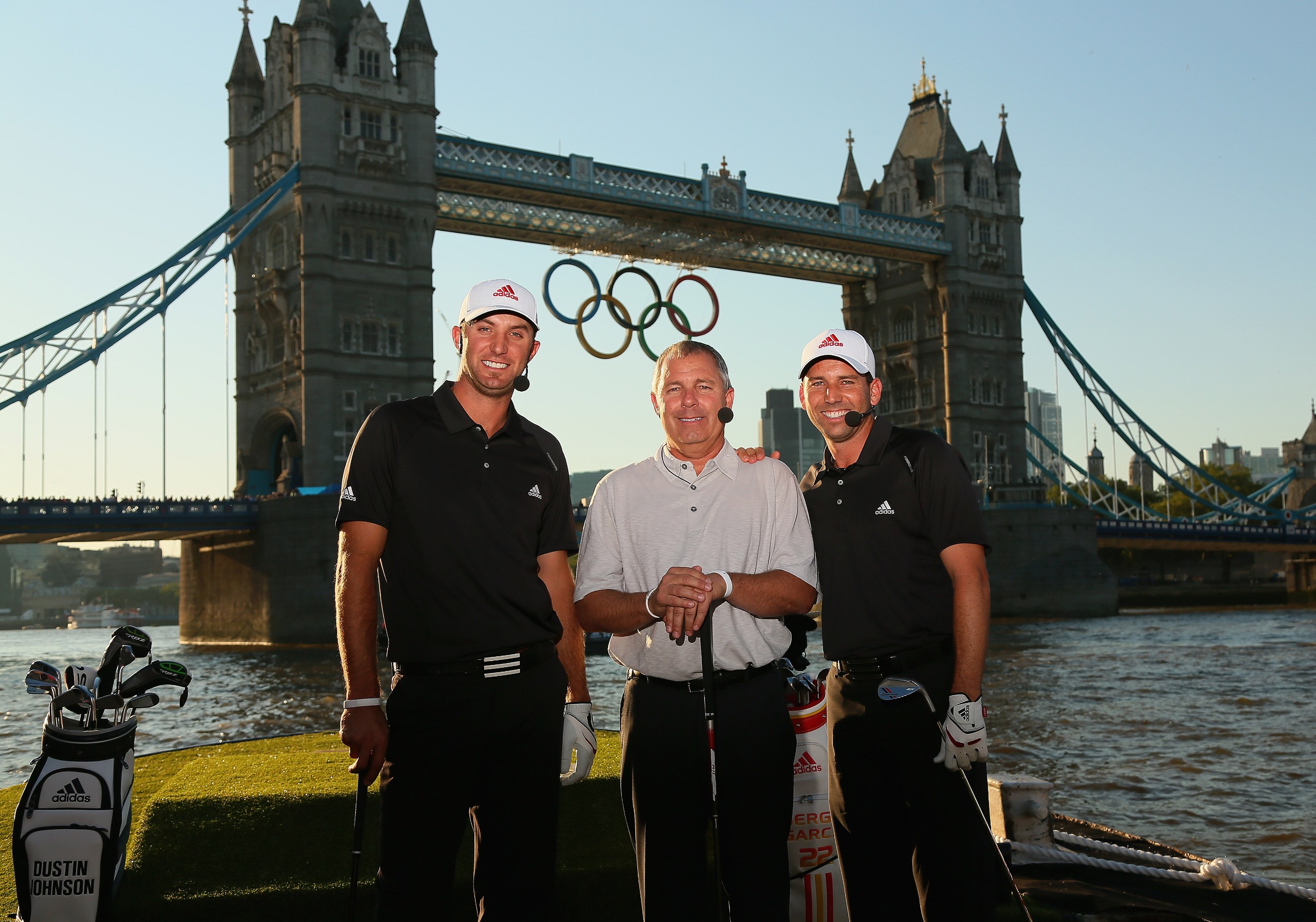 (L to R) Dustin Johnson, Mark King and Sergio Garcia pose during the Adidas Paints the Town Red Adidas London Golf Challenge in 2012