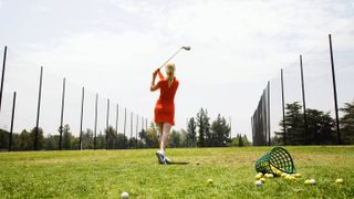 Female golfer at the driving range