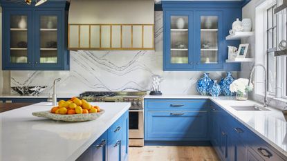 blue kitchen with both brass and chrome hardware