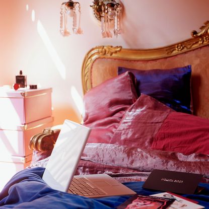 bedroom with bed and laptop