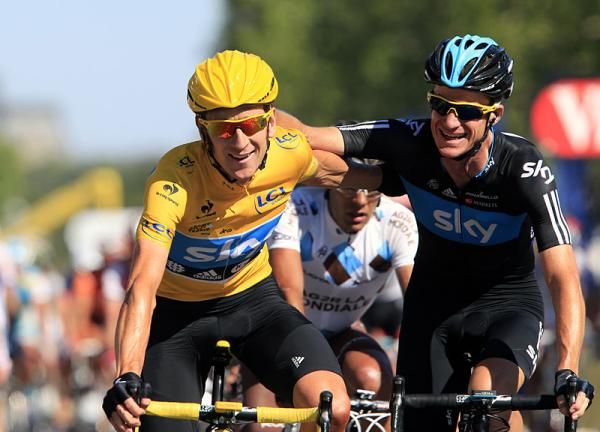 2012 Tour de France champion Bradley Wiggins is congratulated by Sky teammate Michael Rogers as they cross the finish line in Paris.