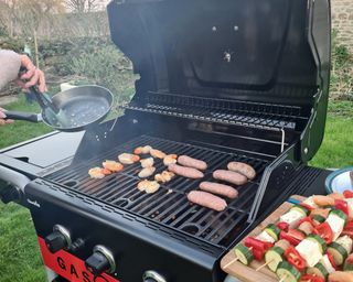Char-Broil Gas2Coal 3-Burner Gas and Charcoal Hybrid Grill being tested in writer's home