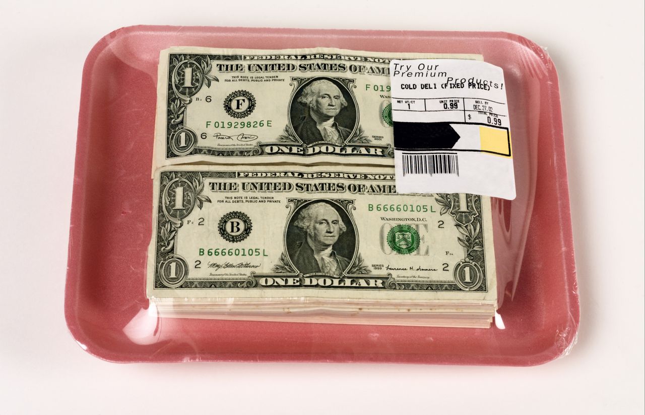 Cash wrapped in meat package.