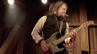 Jake E. Lee with a custom Charvel built by Master Builder Chip Ellis, who sandblasted and stained the axe in a patina finish (inspired by the album’s title) and added copper-plated hardware