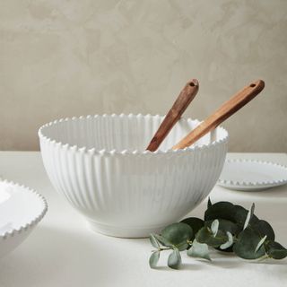 Pearl salad bowl with utensils inside