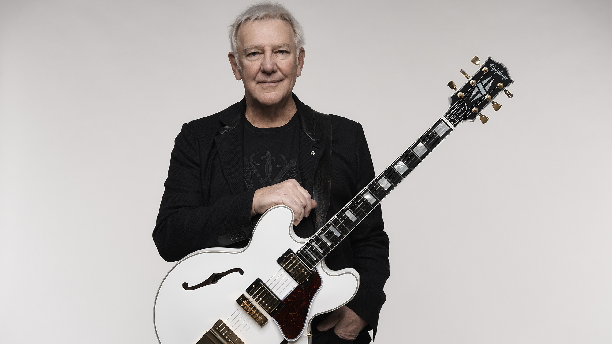 Alex Lifeson poses with his Epiphone Inspired by Gibson "Whitey" ES-355