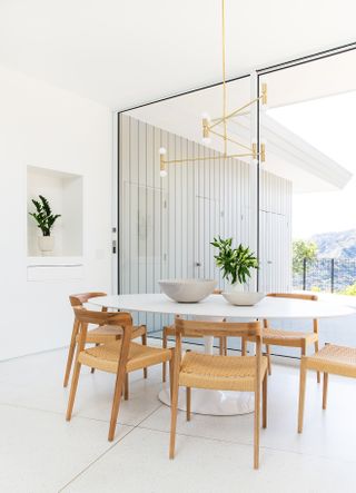 white dining room with large-format terrazzo tile by Sarah Sherman Samuel