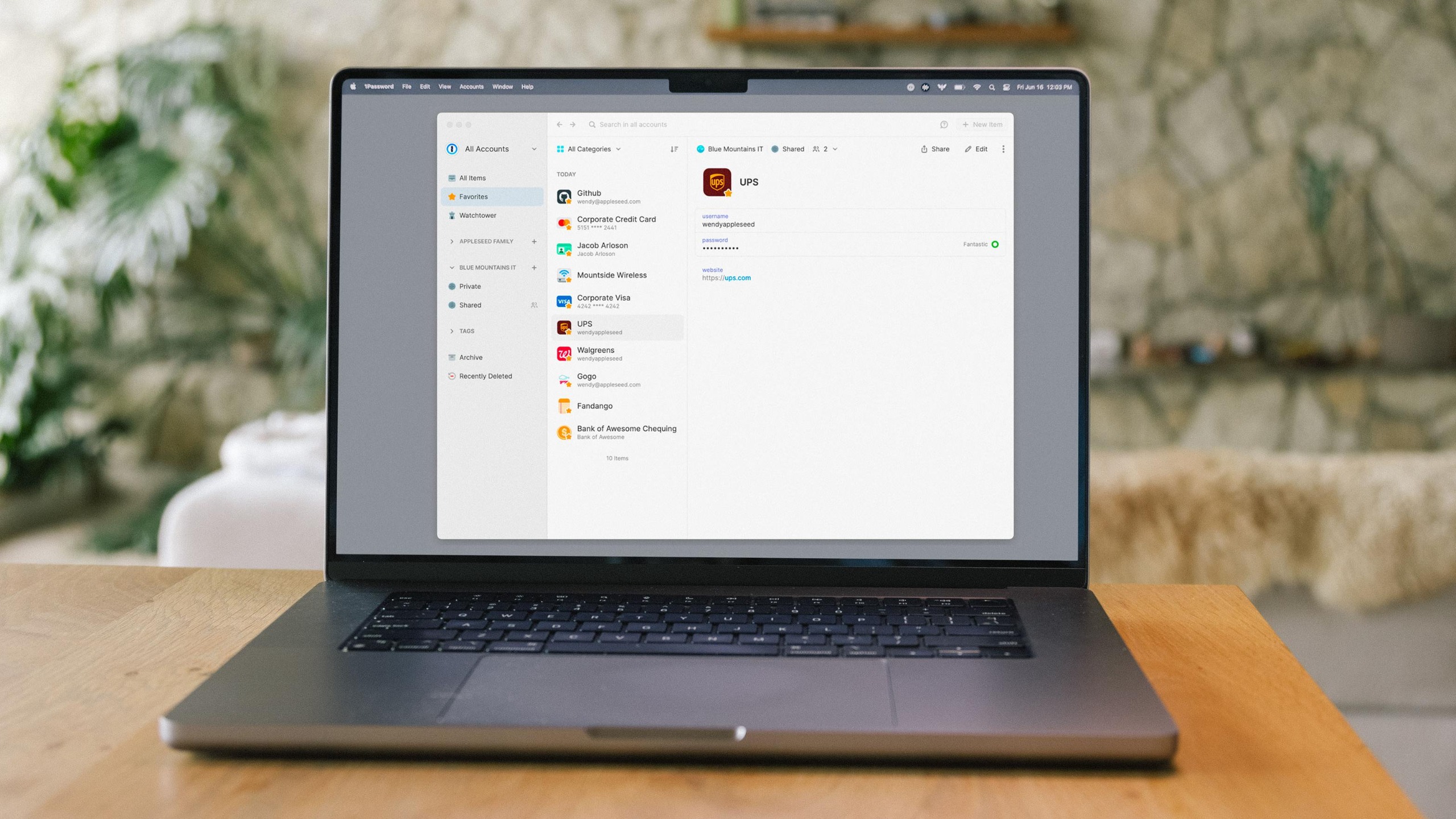 1Password app on laptop sitting on desk
