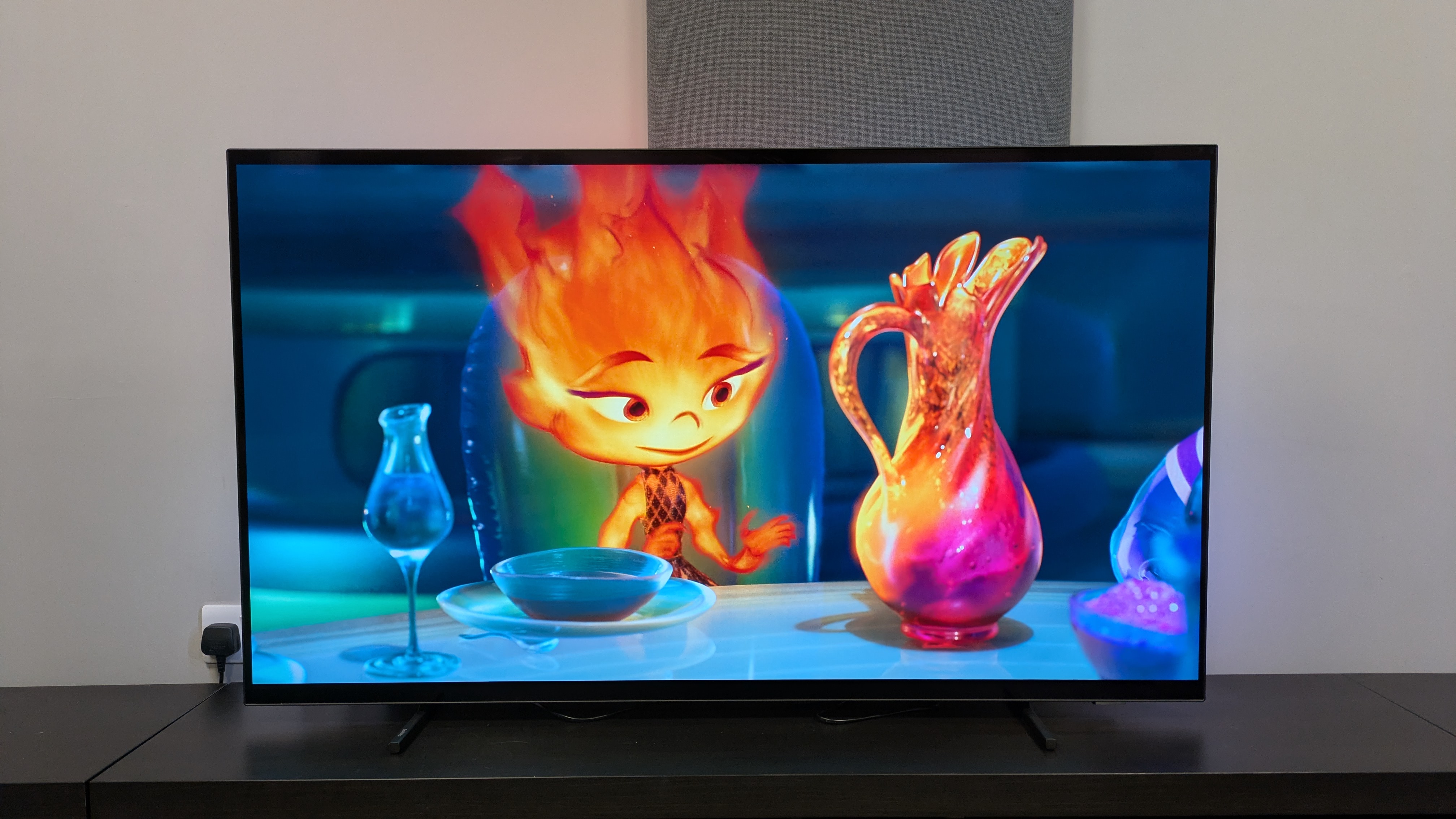Philips OLED760 with a shot of Ember next to vase from the movie Elemental on screen