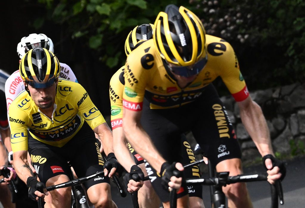 JumboVisma teams Slovenian rider Primoz Roglic L chases the breakaway with teammates during the eighth stage of the 74th edition of the Criterium du Dauphine cycling race 1375 km between SaintAlbanLeysse and Plateau de Solaison on June 12 2022 Photo by Marco BERTORELLO AFP Photo by MARCO BERTORELLOAFP via Getty Images