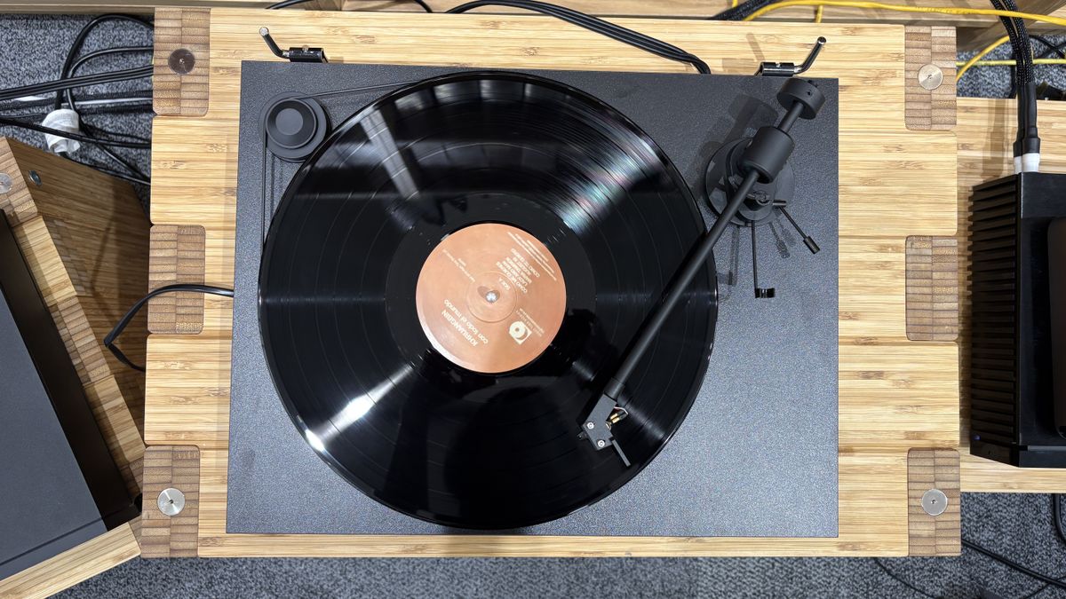Pro-Ject Primary E turntable on wooden rack