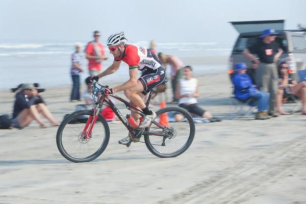 Sid Taberlay motors on the beach.
