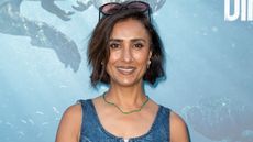 Anita Rani attends the "Prehistoric Planet: Discovering Dinosaurs" Premiere at Lightroom wearing a denim midi dress